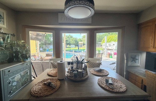 Wichita House | Spacious 4-bedroom house with Private Heated Pool, Outdoor Firepit and TV Oasis