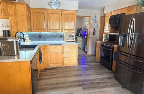 Wichita House | Spacious 4-bedroom house with Private Heated Pool, Outdoor Firepit and TV Oasis