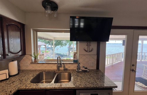 Azle House | Spacious 4-BR lake front WiFi ,hot tub, EV charger on Eagle Mountain Lake Azle