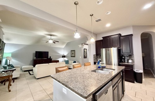 South Side House | Spacious 4BR, 2.5BA home just 15 mins from the beach! Features a 3-car garage, fast Wi-Fi, smart TVs, and a fully equipped kitchen. Quick access to the highway, hospitals, and shopping. Perfect for families, travel nurses, or long-term stays. Enjoy t