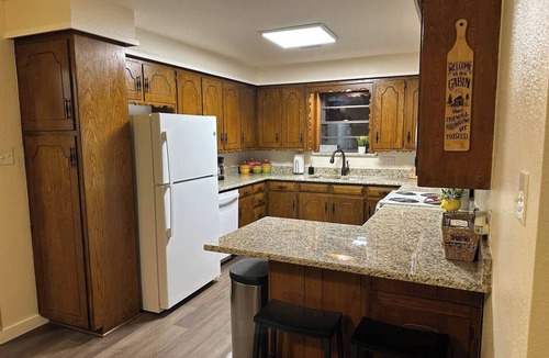 Muenster House | Spacious 5-bedroom, 2-bath retreat that comfortably hosts up to 12 guests. Unwind along Dry Elm Creek, soak in the wide-open skies, and explore nearby Muenster—home to charming local dining, 4R Ranch Vineyards, and Turtle Hill Golf Course.