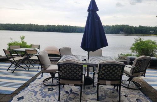 Orange House | Spacious Accessible Waterfront Retreat with Hot Tub