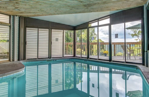 Chalet Village Condo | Spacious and cozy w. screened-in balcony, resort indoor pool + arcade