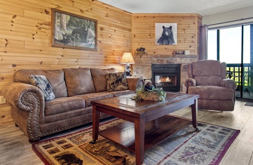 Chalet Village Condo | Spacious and cozy w. screened-in balcony, resort indoor pool + arcade