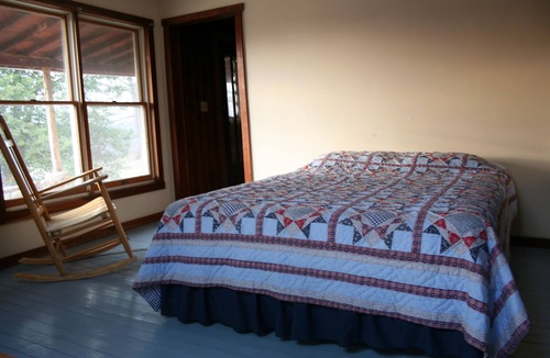 St. James House | Spacious but cozy farmstead lodge has stone fireplace and sleeping for 9 to 10