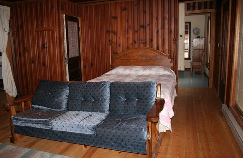 St. James House | Spacious but cozy farmstead lodge has stone fireplace and sleeping for 9 to 10