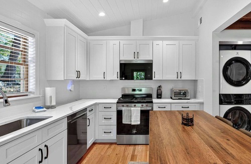 Millville Cabin | Spacious cabin w/private river, hot tub & fire pit