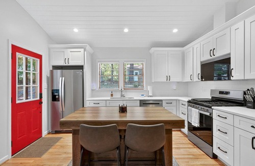Millville Cabin | Spacious cabin w/private river, hot tub & fire pit