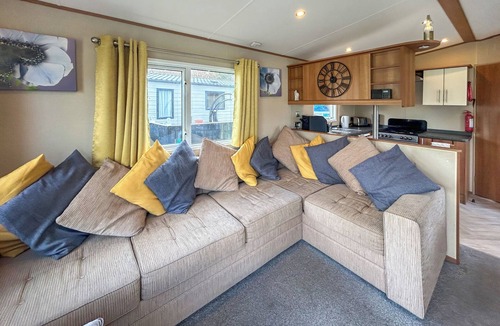 Burnham-on-Sea Apartment | Spacious caravan sleeps six, with private decking and master ensuite.