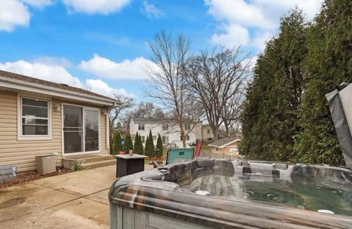 Carol Stream House | Spacious Chicagoland Retreat w/Hot Tub + Fireplace Sleeps 6+