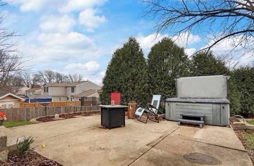 Carol Stream House | Spacious Chicagoland Retreat w/Hot Tub + Fireplace Sleeps 6+
