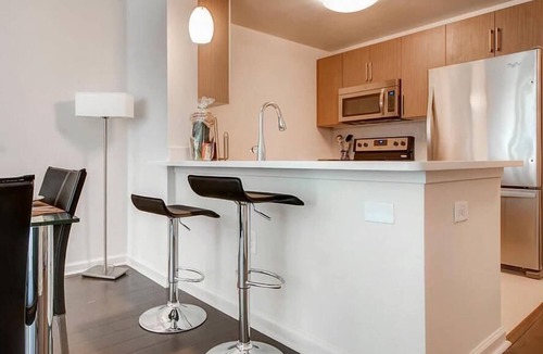 Hudson Exchange Apartment | Spacious & Clean 1BR | Work Desk & WiFi | by GLS