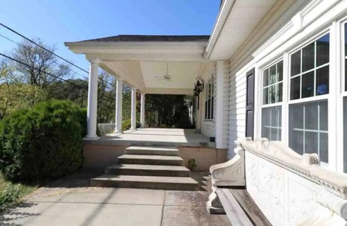 East Point House | Spacious Colonial Home with Sunroom, Jacuzzi & Single-Level Living