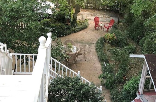 East of Broadway Cabin | Spacious Downtown Cottage with Roof-Top Patio