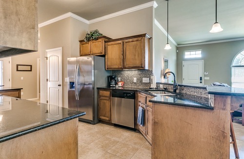 Edmond House | Spacious Edmond Home with Media Room and Fenced Yard