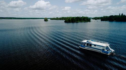Babbitt House | Spacious Getaway Series Cabin-Style Boat with Water Slide Near Babbitt, MN