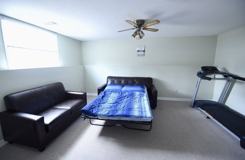 Bayridge West House | Spacious Hearth Escape with Natural Light & fireplace
