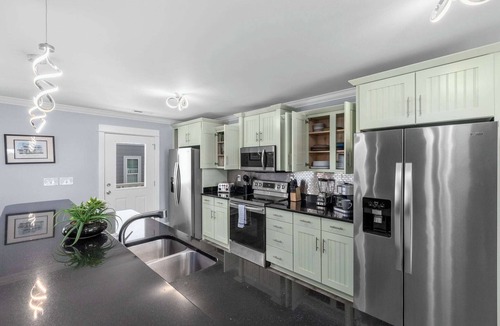 Garden City House | Spacious Home with Private Pool, Steps from the Beach & Marsh Views