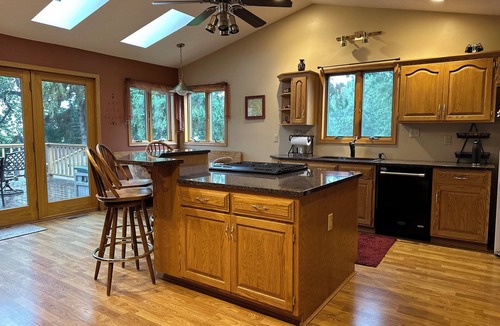 Ortonville House | Spacious home with a large deck and ample space for beautiful sunset viewing!