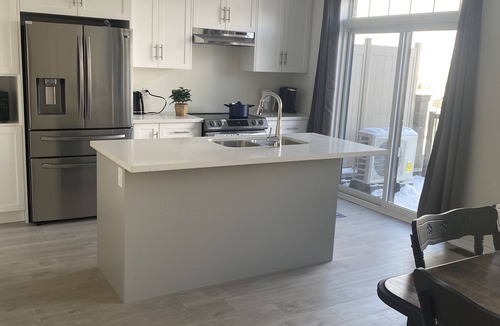 Cambridge House | Spacious luxurious townhouse with double car garage.