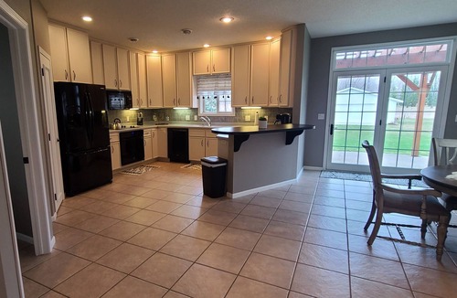 Starbuck House | Spacious one-level family friendly, tranquil backyard with boat access.