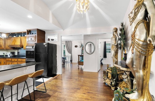 Terry Sanford House | Spacious open floor plan. 5 beds. 5 TVs. & Art.