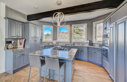 Deer Valley House | Spacious patio at secluded home in peaceful Deer Valley with private hot tub, BBQ grill