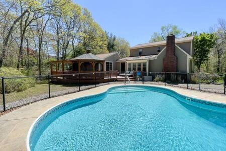 Plymouth House | Spacious Retreat With Pool, Game Room & Fireplace, Sleeps 10, Backyard Oasis and Screened Gazebo, Family-Friendly Getaway, 24Hr Hospitality