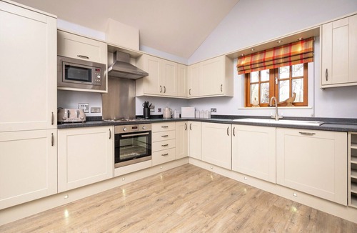 Whitebridge Ski Chalet | Spacious riverside lodge with mountain views.