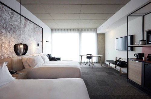 Brossard Hotel | Spacious Room Ideal for Families Near Kid-Friendly Attractions & Dining Options