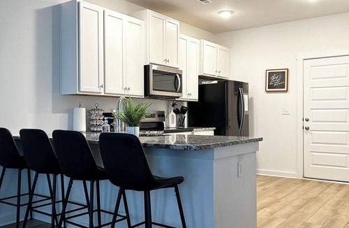 Normal House | Spacious Stay with 2-Car Garage & Multiple TVs