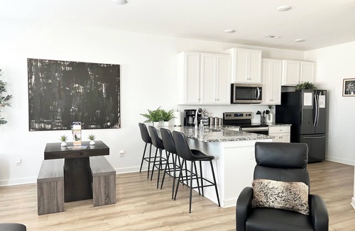 Normal House | Spacious Stay with 2-Car Garage & Multiple TVs
