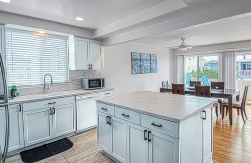 West Newport Apartment | Spacious Upper unit located just two houses from the sand!