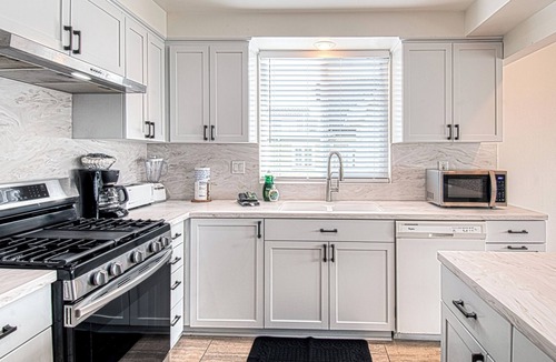 West Newport Apartment | Spacious Upper unit located just two houses from the sand!