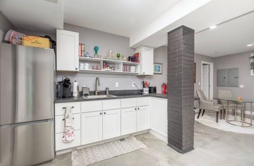 Central West End House | Spacious, well-equipped apartment with quality furnishings for a relaxing stay.