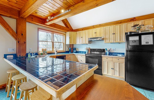 Greenville Junction House | Spectacular lakefront home with dock, firepit, & vaulted ceilings - dog-friendly