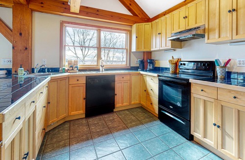 Greenville Junction House | Spectacular lakefront home with dock, firepit, & vaulted ceilings - dog-friendly