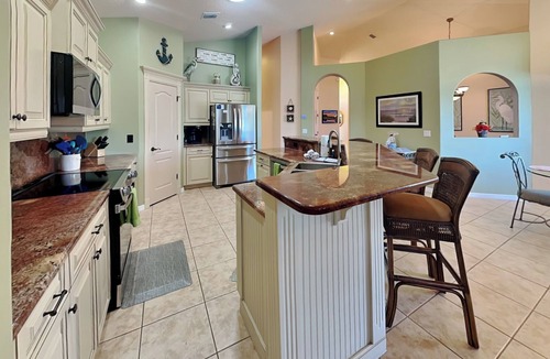 Palm Harbor Cottage | Splashing Dolphins by Distinctive Beach Rentals