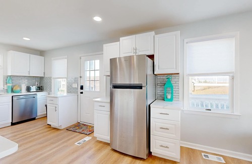 Prime Hook Beach House | Sprawling beachfront home with alfresco dining, grill, games, W/D, & open layout