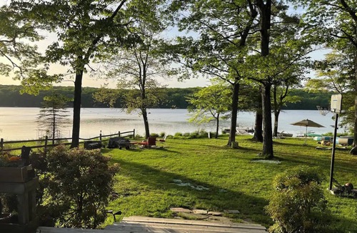 Milford House | Spring fed Lake front home floating dock and boats