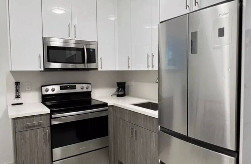 Liberty City Apartment | Stanza Design District Parking Laundry