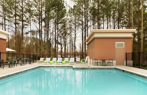 Suwanee House | Stay Awesome in Our Spacious Room! Pets Allowed