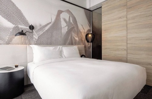 Brossard Hotel | Stay Steps Away from Shopping & Dining in Functionally Designed Room | 3 Units