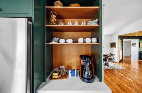 Omena Cottage | Stillwater Cottage - lakefront with chefs kitchen, fireplace, firepit