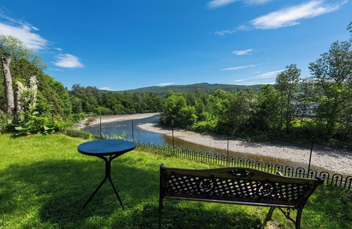 Baie-St-Paul House | Stilt area overlooking a river