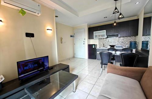 Kelapa Gading Barat Apartment | Strategic 2BR Gading MOI Apt with Wi-Fi, Pool & Gym by 2ndHome