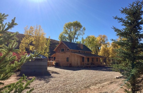 Fruitland Cabin | Strawberry Pinnicals cabin backing to the river located on 14 acres
