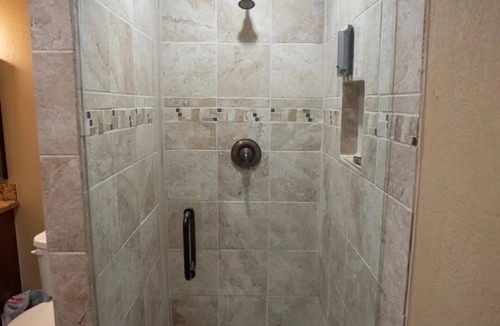 Conroe House | Stucco Private residence for your upcoming gathering.