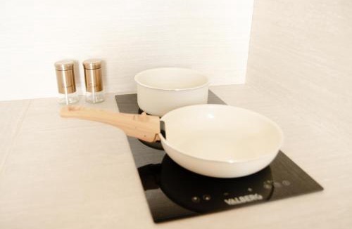 Homecourt Apartment | Studio meublé Le Refuge doré avec Netflix