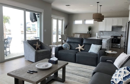 Rockport House | Stunning canal front home with private pool, fire pit, and boat dock